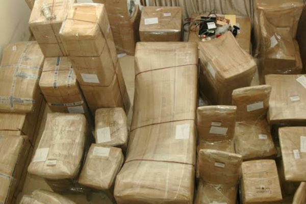 Office interiors being packed with bubble wrap and cardboard boxes